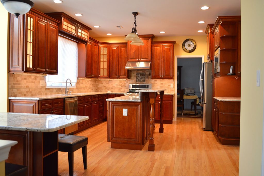 A classic matching wood kitchen design with a center island