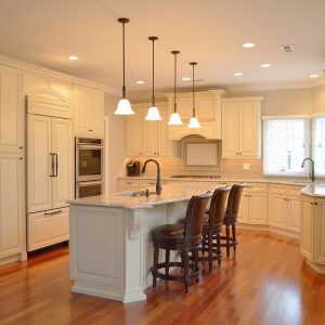 Classic center island kitchen design with additional seating