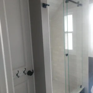 Modern sliding glass shower doors for this bathroom remodel in Bristol