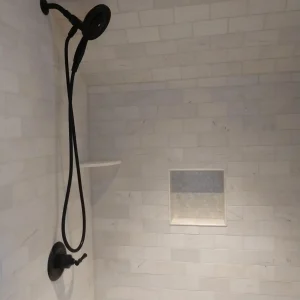 Modern shower head and shower installation during this bathroom remodel in Bristol, PA